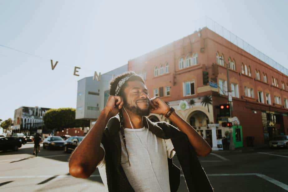 young-man-happy-smile-street-music